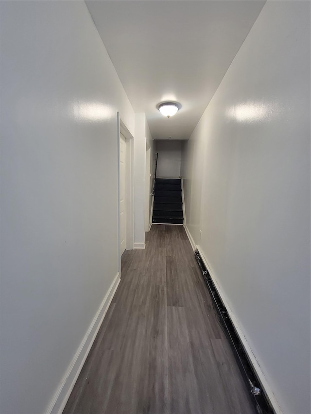 hall with dark hardwood / wood-style flooring