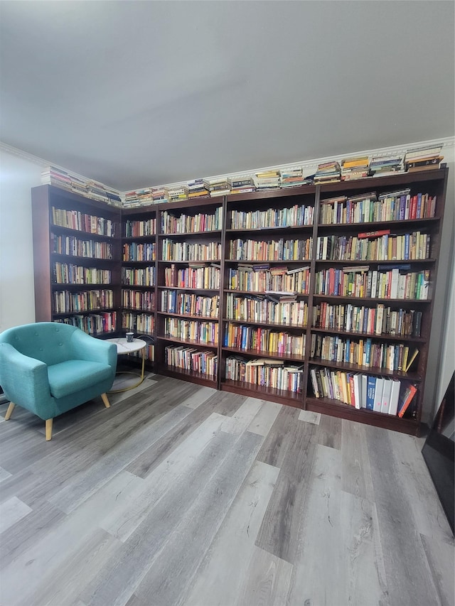 unfurnished room featuring crown molding and hardwood / wood-style floors