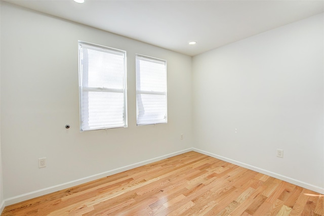 spare room featuring light hardwood / wood-style flooring