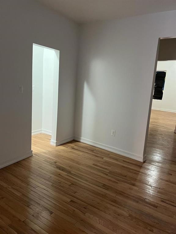 empty room featuring dark hardwood / wood-style floors