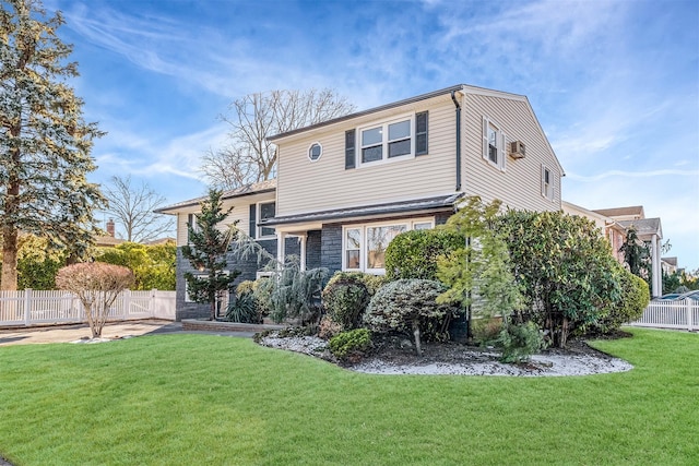 back of property featuring a yard and fence