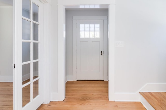 doorway with light wood-type flooring