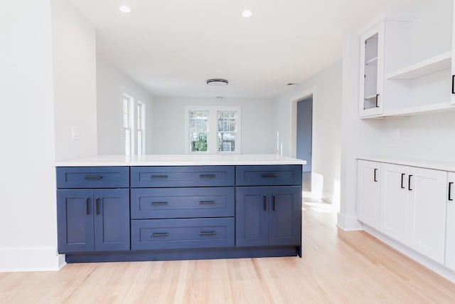 bathroom with hardwood / wood-style floors