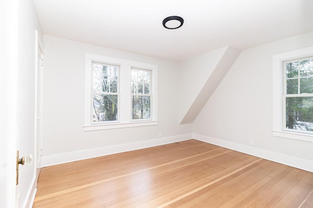 unfurnished room with hardwood / wood-style floors