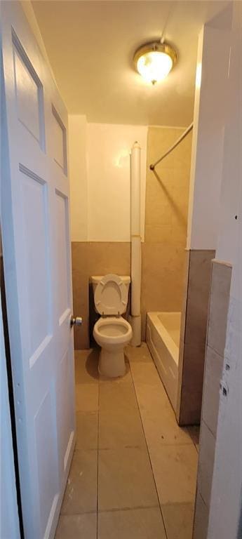 bathroom with tile patterned floors and toilet