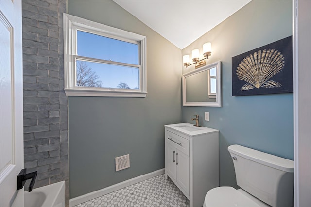 full bathroom featuring shower / tub combination, vanity, vaulted ceiling, and toilet