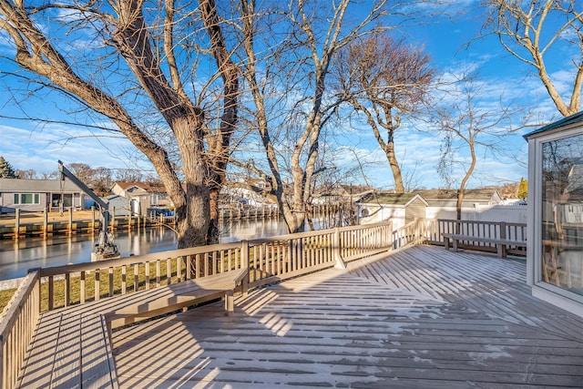 wooden deck with a water view