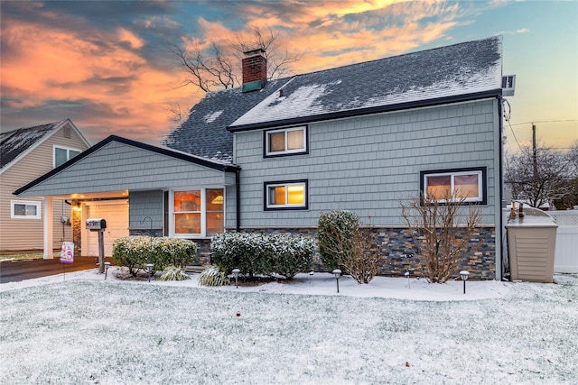 view of snow covered back of property