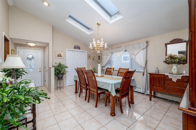 dining area featuring light tile patterned floors, an inviting chandelier, and vaulted ceiling with skylight