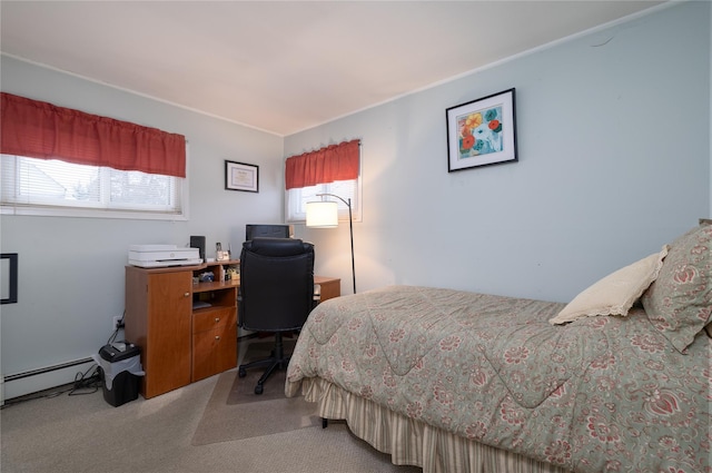 bedroom featuring carpet flooring, baseboard heating, and multiple windows