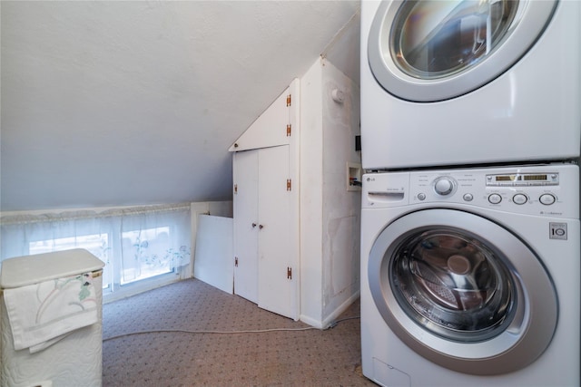 washroom with stacked washer and clothes dryer