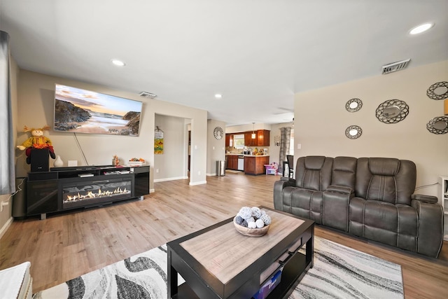 living room featuring light wood-type flooring