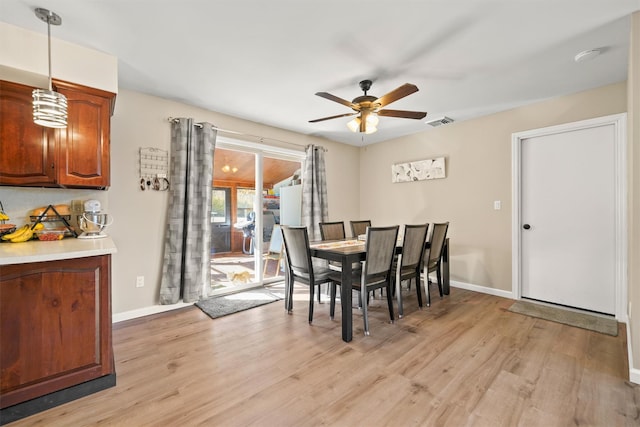 dining space featuring ceiling fan and light hardwood / wood-style flooring