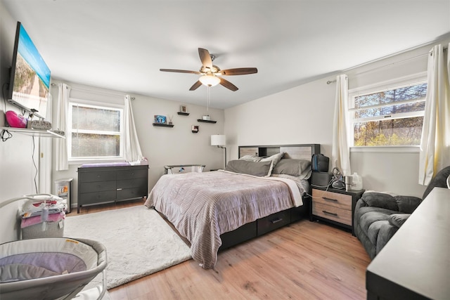 bedroom featuring ceiling fan and light hardwood / wood-style floors