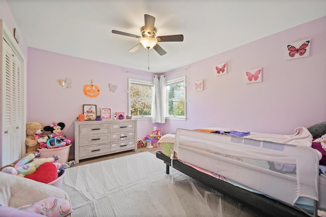 bedroom featuring ceiling fan and a closet