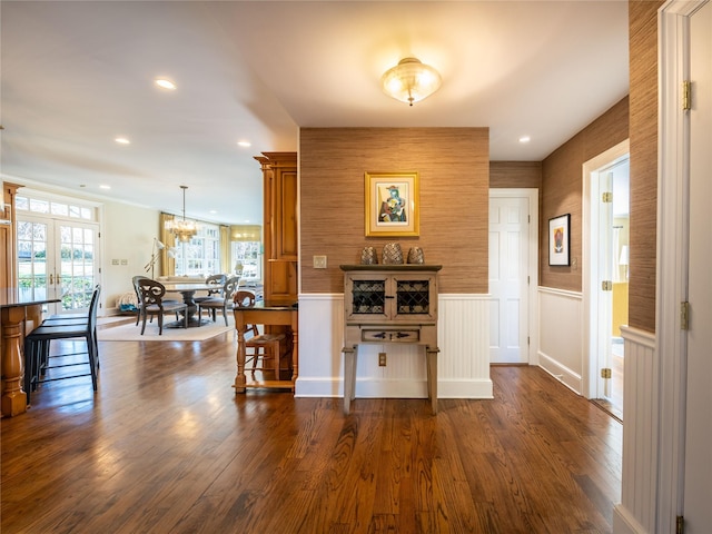 dining room featuring dark hardwood / wood-style flooring and a chandelier