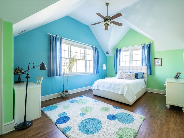 bedroom with ceiling fan, vaulted ceiling, and dark wood-type flooring