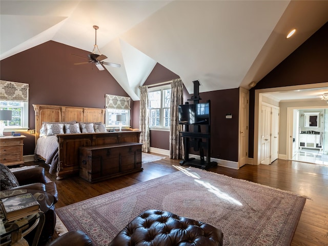 bedroom featuring ceiling fan, dark hardwood / wood-style flooring, and lofted ceiling