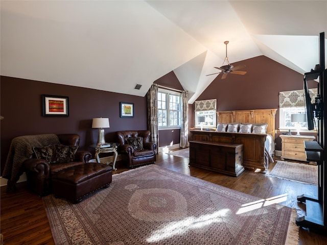 bedroom with ceiling fan, lofted ceiling, and dark hardwood / wood-style floors