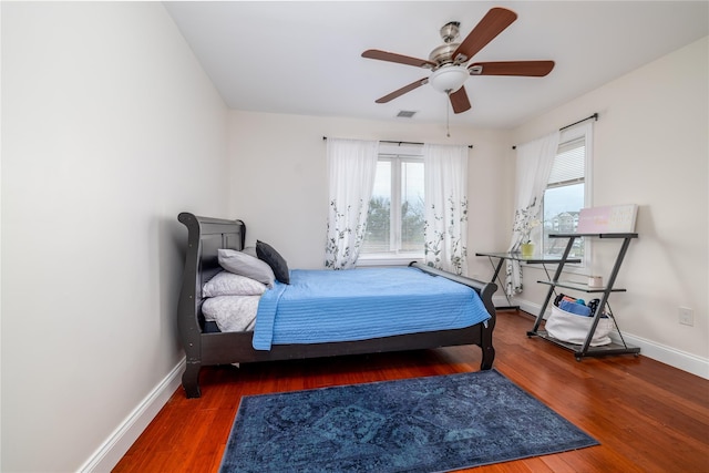 bedroom with dark wood-type flooring and ceiling fan