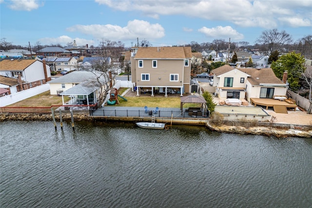 birds eye view of property with a water view