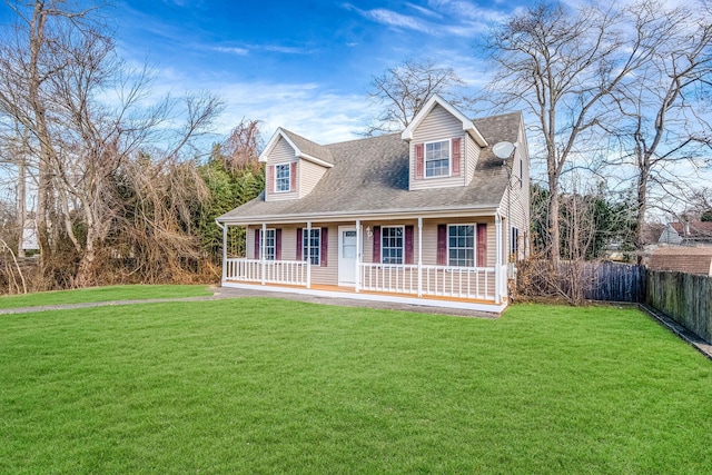 cape cod home with a porch and a front lawn