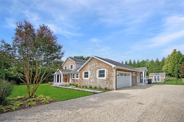 view of front of property featuring a garage and a front yard