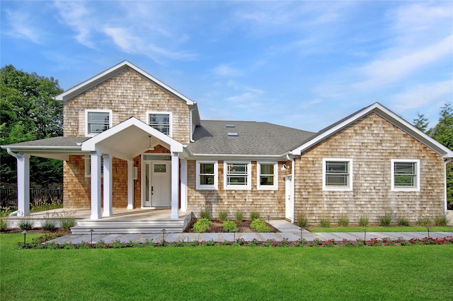 view of front of house featuring a porch and a front yard