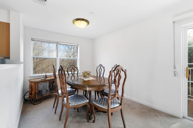 view of carpeted dining space