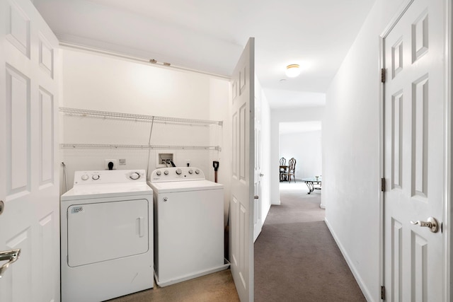 washroom featuring washer and clothes dryer and carpet