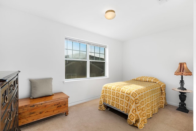 bedroom featuring light colored carpet