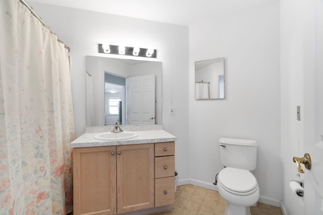 bathroom featuring toilet and vanity