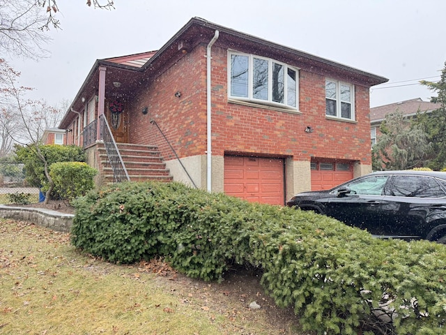 view of side of property with a garage