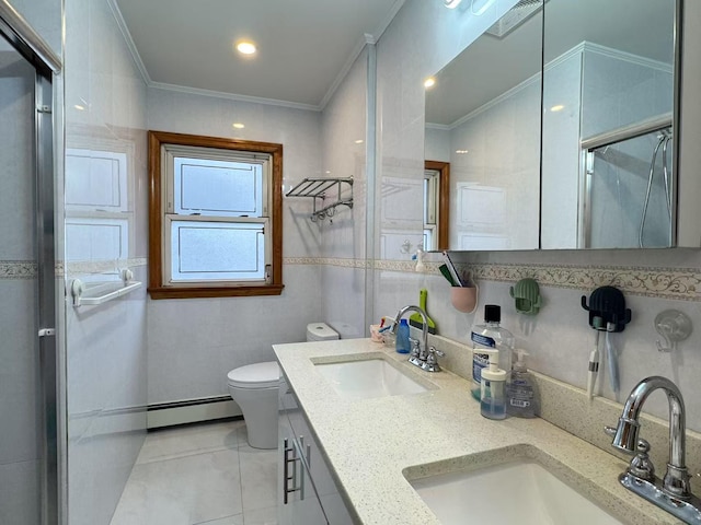 bathroom with vanity, ornamental molding, tile walls, and a baseboard heating unit