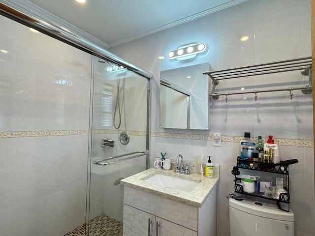 bathroom with an enclosed shower, vanity, tile walls, and crown molding