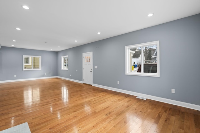 unfurnished living room featuring light hardwood / wood-style flooring