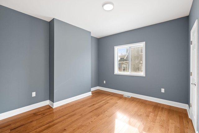 unfurnished room featuring light wood-type flooring