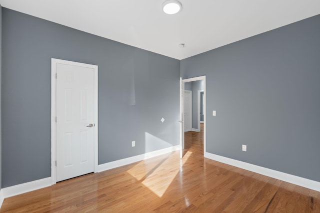 unfurnished room featuring hardwood / wood-style floors