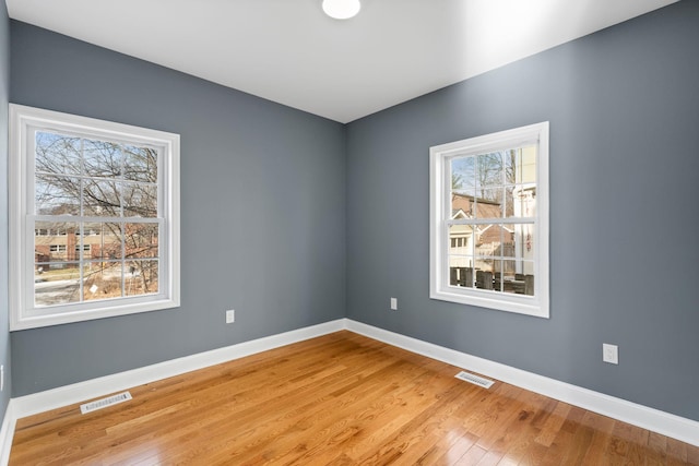 spare room with light wood-type flooring