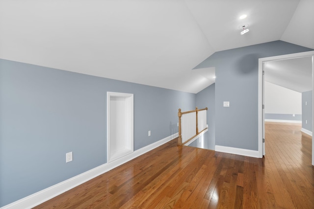 bonus room featuring hardwood / wood-style floors and vaulted ceiling