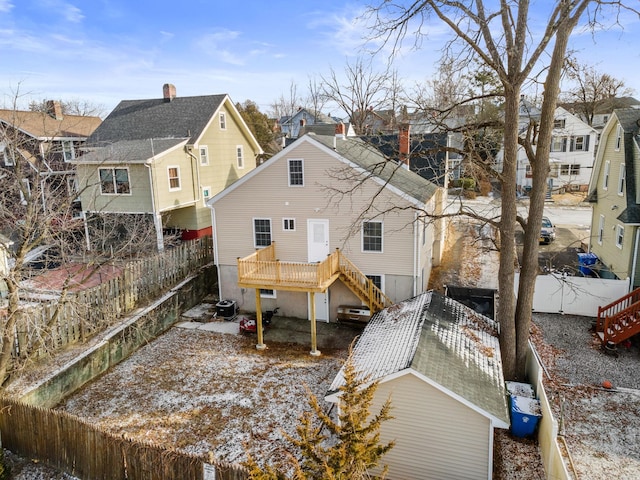 back of property featuring central AC unit