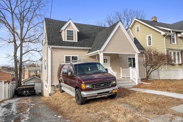 view of front facade with an outbuilding and a garage