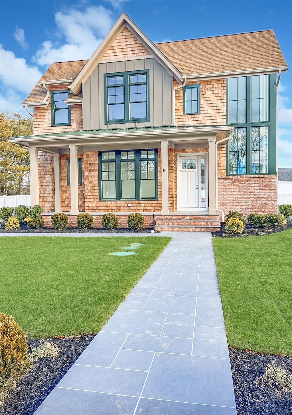 craftsman inspired home with a front yard