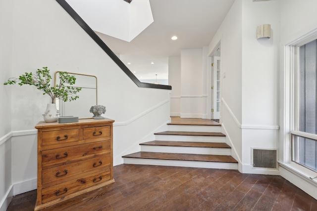 staircase with hardwood / wood-style floors