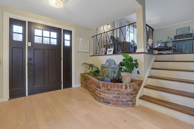 entrance foyer featuring hardwood / wood-style flooring