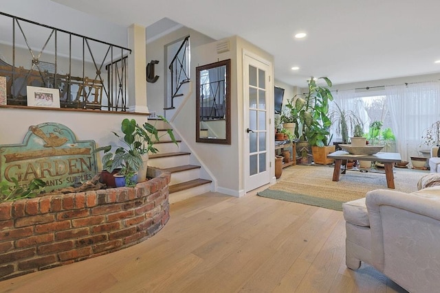 living room featuring french doors and hardwood / wood-style floors