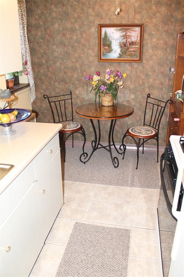 dining area featuring light tile patterned floors