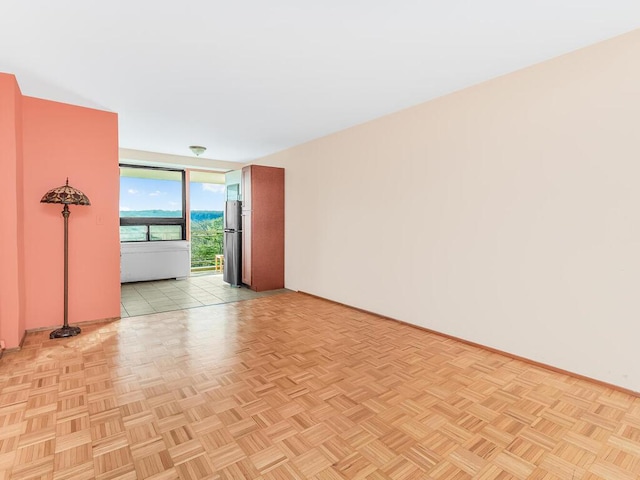 empty room with light parquet floors