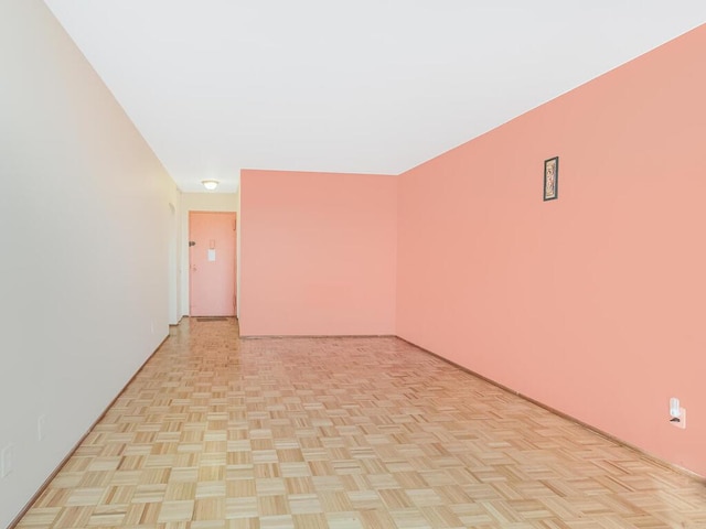 empty room with light parquet floors