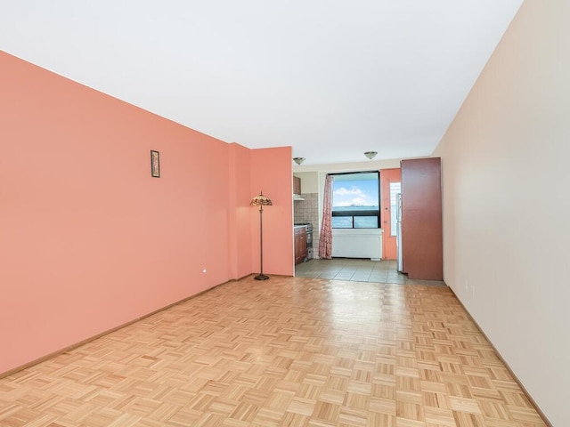 unfurnished room with light parquet floors